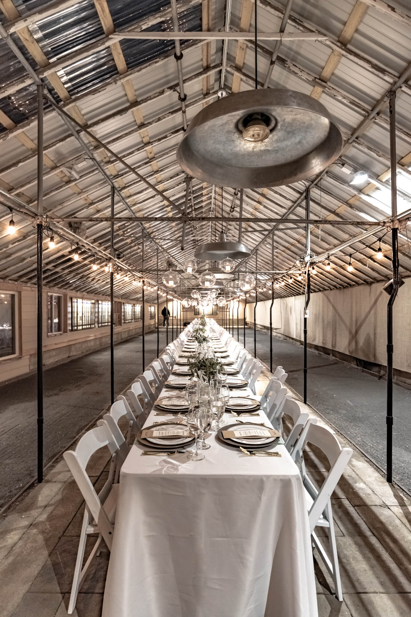 A long table set inside a Goldner Walsh greenhouse